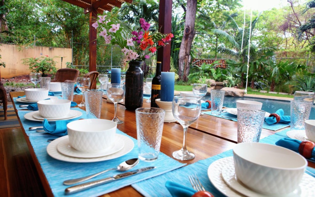 Place settings on the outdoor table at Casa Colorado, a vacation rental home with a private pool in Tamarindo, Costa Rica