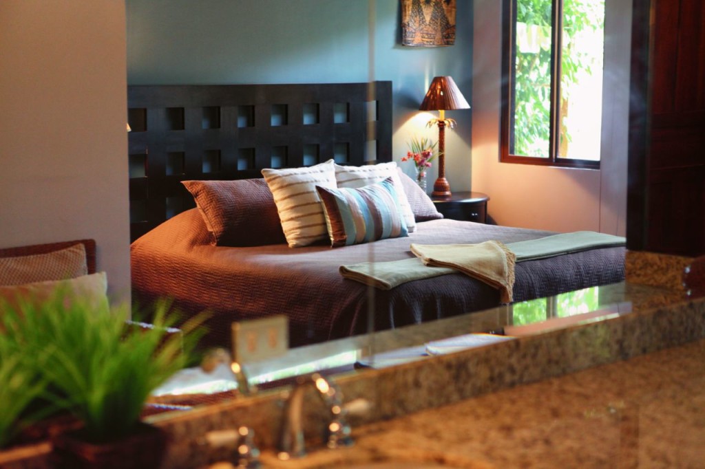 The king bed from the master bathroom vanity at Casa Colorado, a vacation rental home with a private pool in Tamarindo, Costa Rica