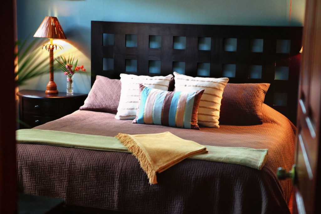 The master suite headboard and lamps at Casa Colorado, a vacation rental home with a private pool in Tamarindo, Costa Rica