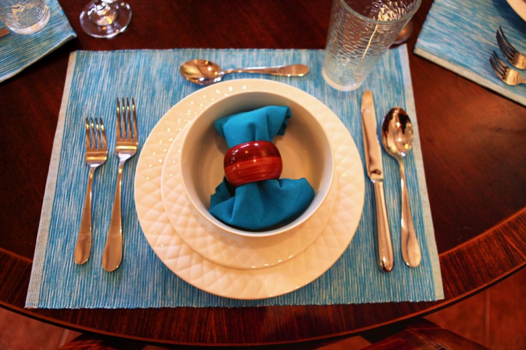 A place setting with a blue napkin at Casa Colorado, a vacation rental home with a private pool in Tamarindo, Costa Rica