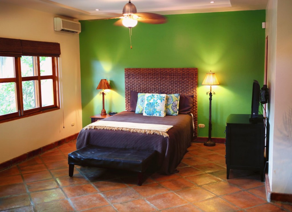 The casita bedroom with a ceiling fan at Casa Colorado, a vacation rental home with a private pool in Tamarindo, Costa Rica