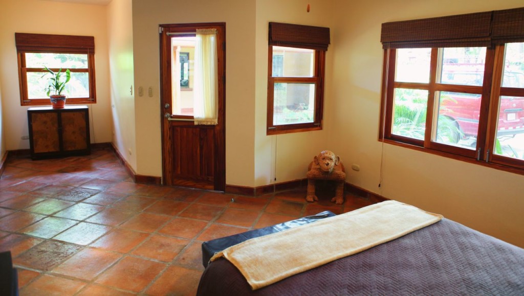 The casita living space with windows at Casa Colorado, a vacation rental home with a private pool in Tamarindo, Costa Rica